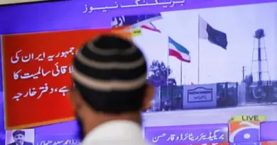 Man watches television report on Iran-Pakistan conflict. Photo Credit: Fars News Agency