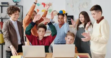 children teacher classroom computers laptops fun
