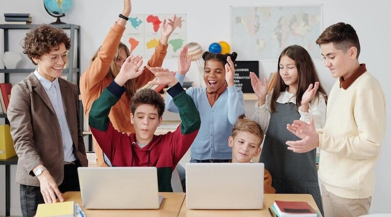 children teacher classroom computers laptops fun