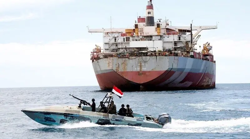 File photo of Houthi rebels patrolling near a merchant ship in Red Sea. Photo Credit: Fars News Agency