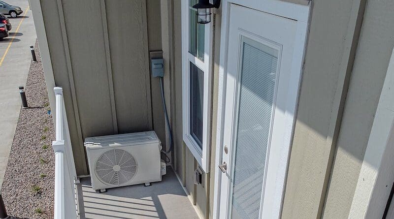 A heat pump on the balcony of an apartment. Photo Credit: Wikideas1