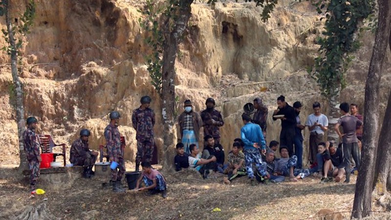 Members of the Myanmar junta-affiliated Border Guard Police (BGP) are seen at a Bangladesh Border Guard encampment in Bandarban, Bangladesh, after they fled from fighting across the border in Myanmar, Feb. 5, 2024. Photo Credit: Minhaz Uddin/BenarNews