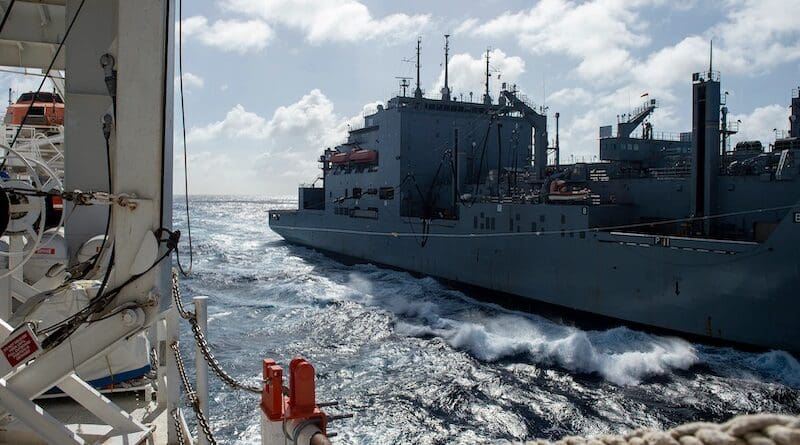 The dry cargo/ammunition ship USNS William McLean refuels the hospital ship USNS Comfort off the coast of Panama. Photo Credit: DOD