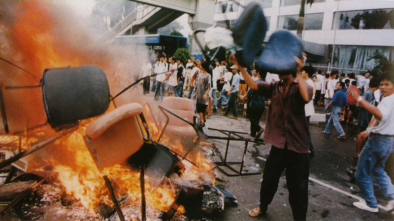 Shops looted and goods burned on the streets in Jakarta, Indonesia in fallout from 1997 Southeast Asian Financial Crisis. Photo Credit: Office of the Vice President The Republic of Indonesia, Wikipedia Commons