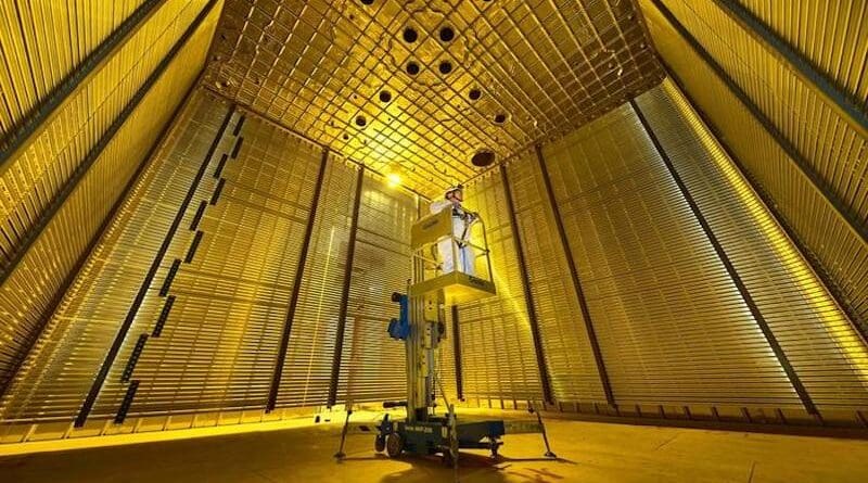 Jaehoon Yu, UTA professor of physics, stands on an elevated platform inside the DUNE field cage prototype after its completion at CERN in 2018. CREDIT: UT Arlington