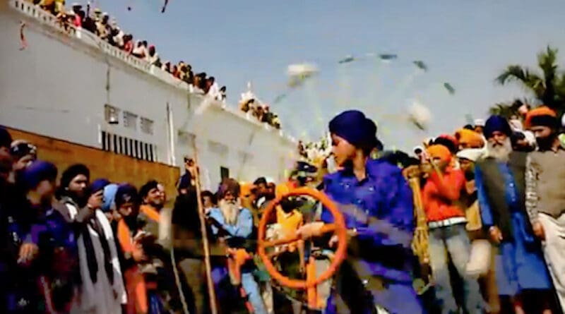 The Khalsa celebrating the Sikh festival Hola Mohalla. Photo Credit: Sanjay Maggo, Wikipedia Commons