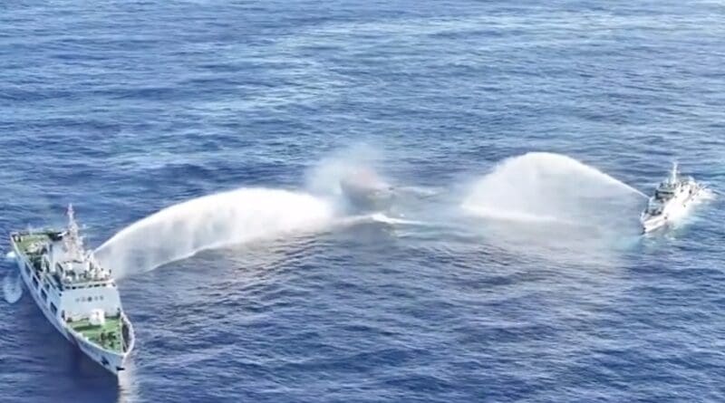 China Coast Guard ships (left and right) deploy water cannons at the Philippine military-chartered civilian boat Unaizah May 4 (center) during its supply mission near Second Thomas Shoal in the disputed South China Sea. Photo Credit: Philippine Coast Guard (PCG) video screenshot