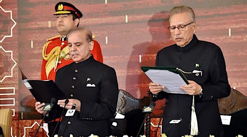 In this handout photograph taken and released by the Pakistan President House on March 4, 2024, Pakistan's President Arif Alvi (2R) administers the oath to newly sworn-in Prime Minister Shehbaz Sharif (2L) at the President House in Islamabad. (Supplied)