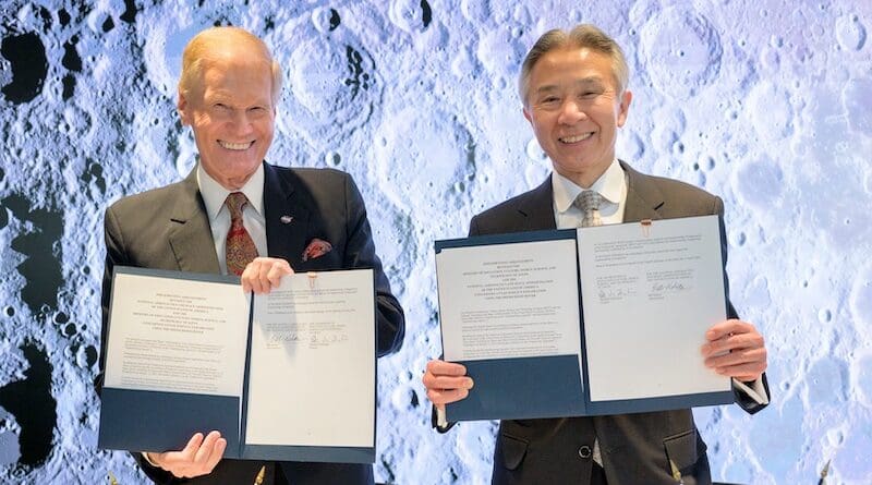 NASA Administrator Bill Nelson, left, and Japan’s Minister of Education, Culture, Sports, Science and Technology Masahito Moriyama, hold signed copies of an historic agreement between the United States and Japan to advance sustainable human exploration of the Moon, Tuesday, April 9, 2024, at the NASA Headquarters Mary W. Jackson Building in Washington. Under the agreement, Japan will design, develop, and operate a pressurized rover for crewed and uncrewed exploration on the Moon. NASA will provide the launch and delivery of the rover to the Moon as well as two Japanese astronaut missions to the lunar surface. Photo Credit: (NASA/Bill Ingalls)