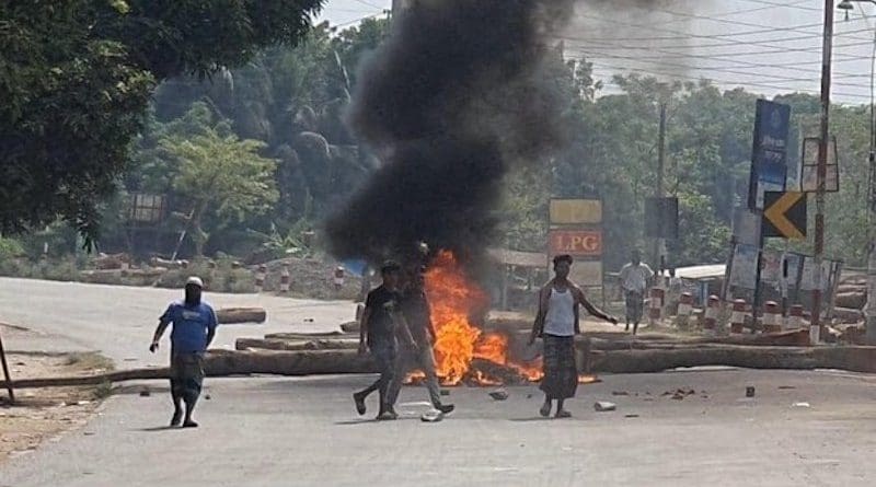 Demonstrators block a highway with tree stumps and by lighting fires to protest a mob last week beating to death two men in the central Faridpur district of Bangladesh, April 24. [BenarNews]