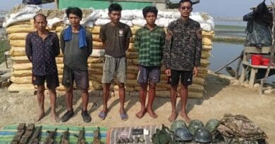 Myanmar Border Guard Police who fled from the Rakhine state to Teknaf, Bangladesh, are shown with weapons and other gear they brought with them, April 17, 2024. Photo Credit: BenarNews