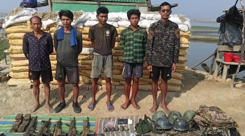 Myanmar Border Guard Police who fled from the Rakhine state to Teknaf, Bangladesh, are shown with weapons and other gear they brought with them, April 17, 2024. Photo Credit: BenarNews