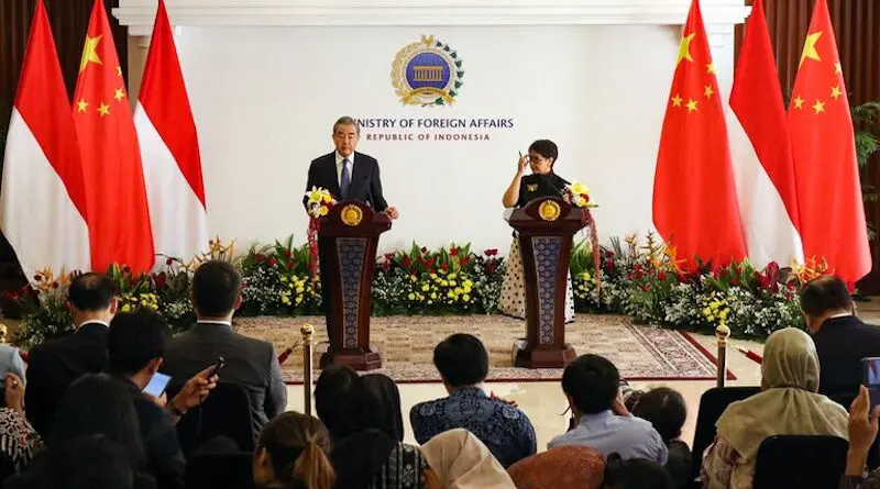 China's Foreign Minister Wang Yi (left) and Indonesia's Foreign Minister Retno Marsudi attend a press conference after their meeting at the Ministry of Foreign Affairs in Jakarta, April 18, 2024. [Eko Siswono Toyudho/ BenarNews]
