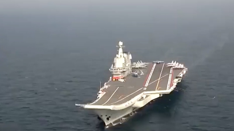 File photo of the Chinese CNS Shandong aircraft carrier in the South China Sea. Photo Credit: Screenshot China PLA Navy video