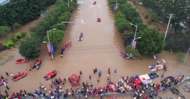 Rescue workers evacuate flood-affected people in Zhuozhou. Photo Credit: China News Service, Wikipedia Commons