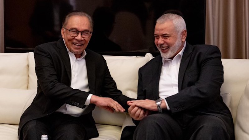 Malaysia's Prime Minister Anwar Ibrahim with Ismail Haniyeh, leader of the Palestinian group Hamas, in Qatar. Photo Credit: Facebook/Anwar Ibrahim