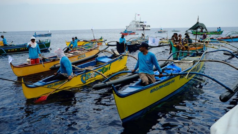 Filipino fishermen aboard small wooden boats join the first part of the civilian convoy from Masinloc port in Zambales province, Philippines, May 15, 2024. Photo Credit: Jojo Riñoza/BenarNews