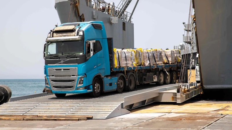 A truck carrying humanitarian aid moves off the causeway in Gaza. Photo Credit: U.S. Central Command