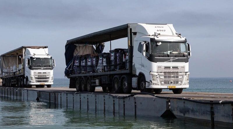 Trucks delivering humanitarian aid to Gaza cross temporary pier. Photo Credit: CENTCOM