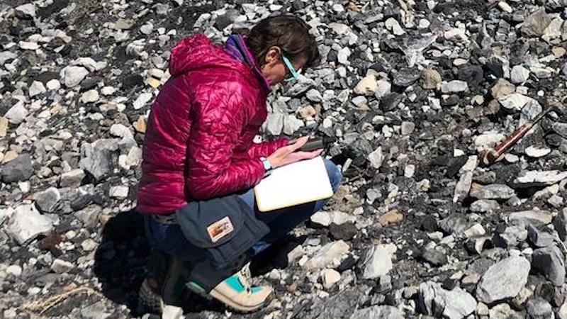 University of Utah geologist Lauren Birgenheier inspects samples at coal processing waste pile. CREDIT: Michael Vanden Berg, Utah Geological Survey