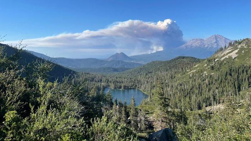A wildfire smoke plume billows above Castle Lake, near Mount Shasta, on June 29, 2021. CREDIT: Erin Suenaga/University of Nevada-Reno