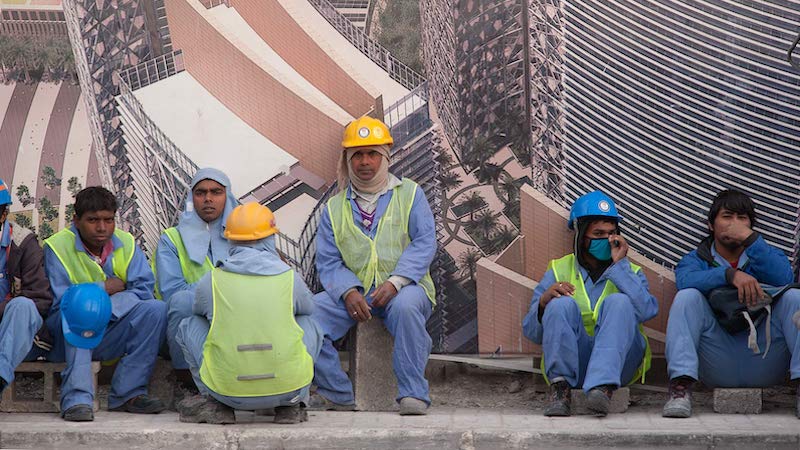 Migrant workers from South Asia in Doha, Qatar. Photo Credit: Alex Sergeev, Wikipedia Commons