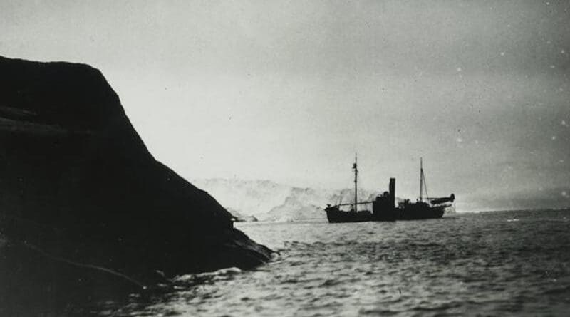 The whaling ship Firern, with the Stinson Reliant aircraft on board, near Klarius Mikkelsen Fjell in Lars Christensen Land in East Antarctica. Copyright Norwegian Polar Institute