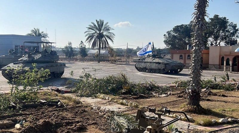 Israeli 401st Brigade combat team tanks enter the Palestinian side of the Rafah border crossing between Gaza and Egypt in the southern Gaza Strip. Photo Credit: IDF, X