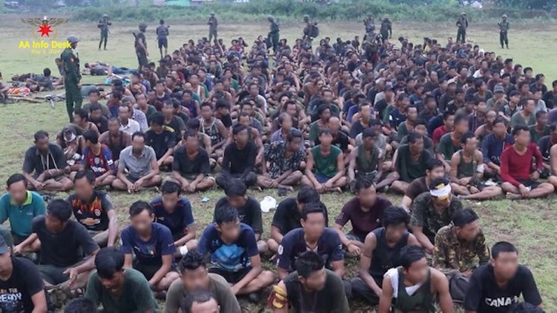 Junta troops and family members under No.15 Operation Command Headquarters surrendered to the Arakan Army. Their faces have been blurred by RFA in this photo released May 6, 2024. Photo Credit: Arakan Army Information Desk