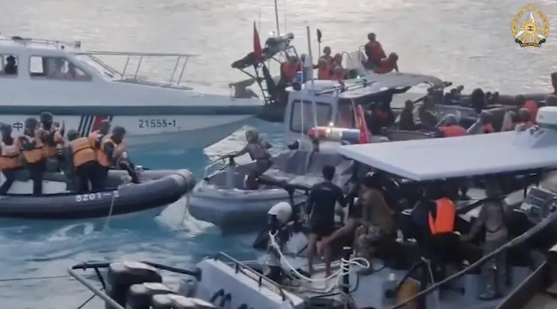 This screengrab taken from a handout video filmed on June 17, 2024, and released by Armed Forces of the Philippines shows Chinese coast guard personnel aboard their inflatable boats blocking Philippine navy boats during a confrontation at the Second Thomas Shoal in the South China Sea. Phoot Credit: Armed Forces of the Philippines video, X