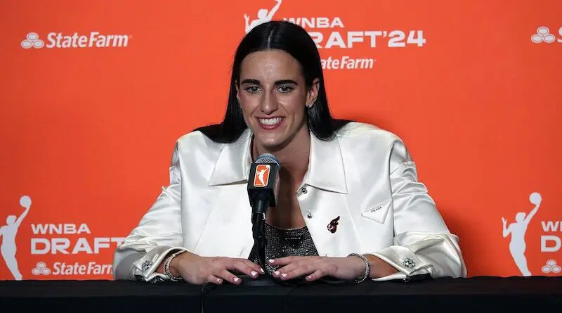 Caitlin Clark addresses the media in her press conference shortly after being selected first overall in the 2024 WNBA Draft. Photo Credit: JazzyJoeyD, Wikipedia Commons