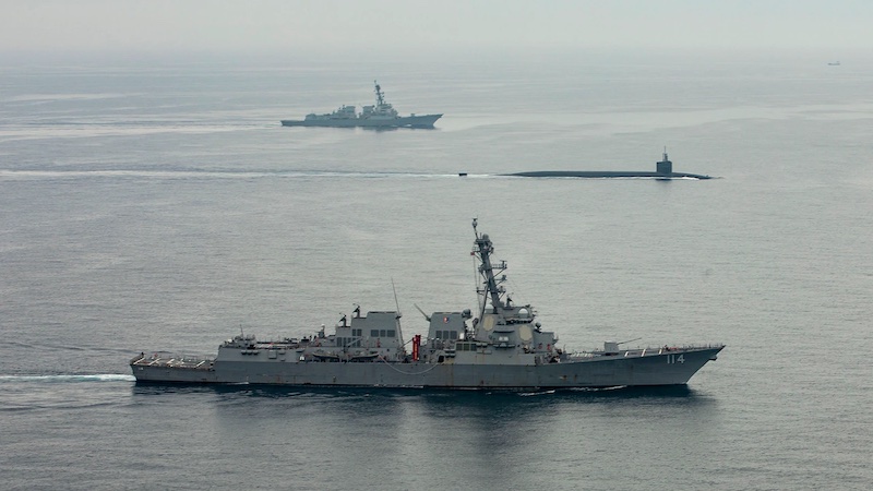 Ohio-class ballistic-missile submarine USS Kentucky proceeds on the surface to Busan for a port visit while escorted by Arleigh Burke-class guided-missile destroyers USS John Finn and USS Ralph Johnson. Photo Credit: Navy Petty Officer 2nd Class Samantha Oblander