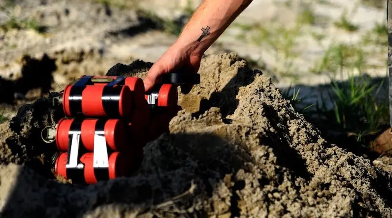 File photo of a US soldier placing a nest of thermite charges. Photo Credit: Airman 1st Class Gustavo Castillo, DOD
