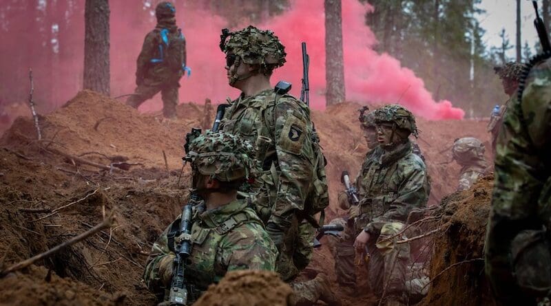 US Army infantry soldiers wait for further instruction during a force on force exercise near Tapa, Estonia, on April 14, 2024. (US Army photo by Spc. Trey Gonzales)