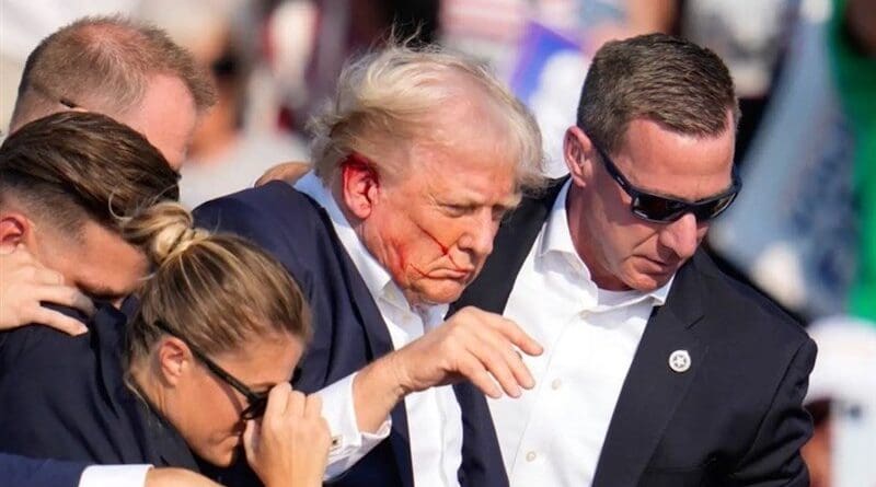 Members of Secret Service rush former US President Donald Trump off stage after assassination attempt. Photo Credit: Tasnim News Agency