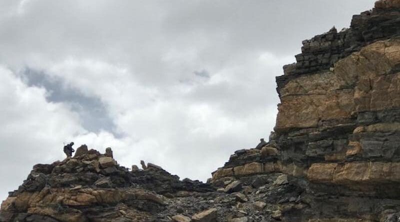 A geologist collects magma samples in a field campaign over the Tibetan Plateau. CREDIT: HU Fangyang