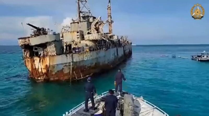 This image from a video released by the Armed Forces of the Philippines shows Philippine troops standing on the edge of a civilian supply boat approaching the BRP Sierra Madre, near Second Thomas Shoal in the South China Sea, Sept. 26, 2024. Photo Credit: HO/Armed Forces of the Philippines