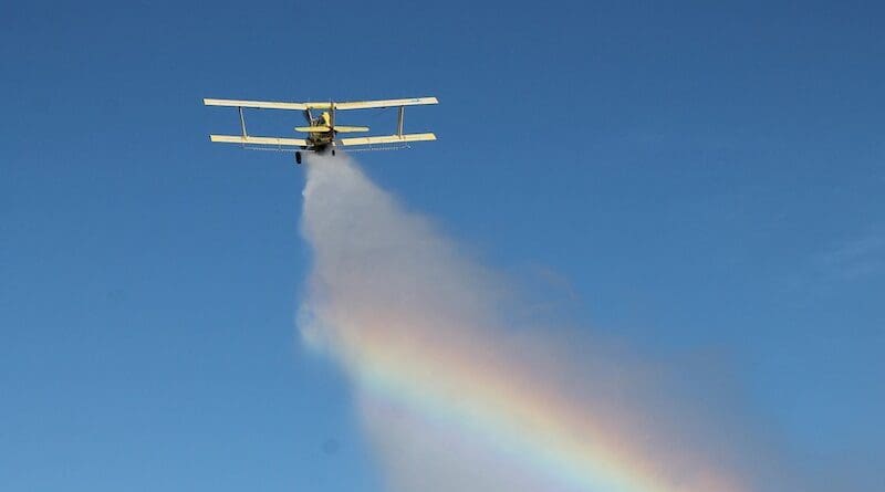 crop duster plan airplane cloud seeding spray