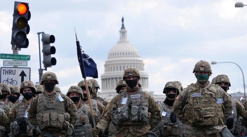 Soldiers assigned to the Indiana National Guard stand in formation in Washington, D.C., Jan. 20, 2021, as part of an effort to enhance security during the 59th presidential inauguration. U.S. service members are frequently tasked with providing support to partner federal agencies. Photo Credit: Army Sgt. Tackora Hand, National Guard