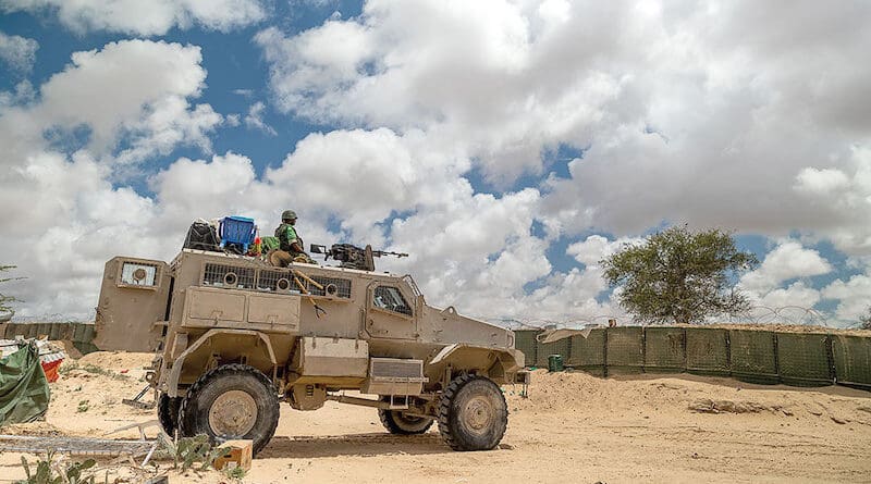 A Burundian Soldier serving in the African Union Transition Mission in Somalia keeps watch from an armored personnel carrier in Hirshabelle State. Photo Credit: ATMIS