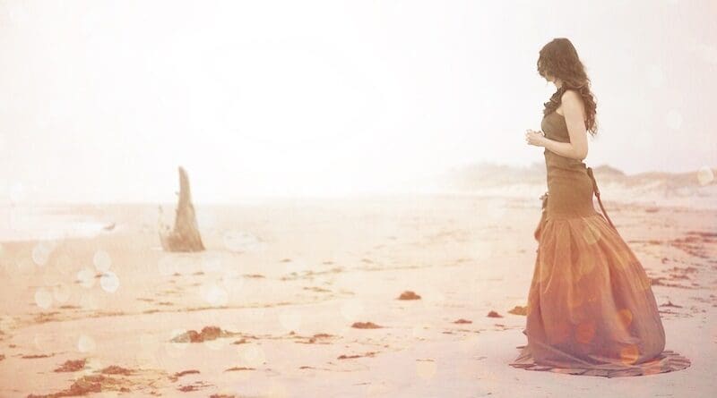 woman beach mirage