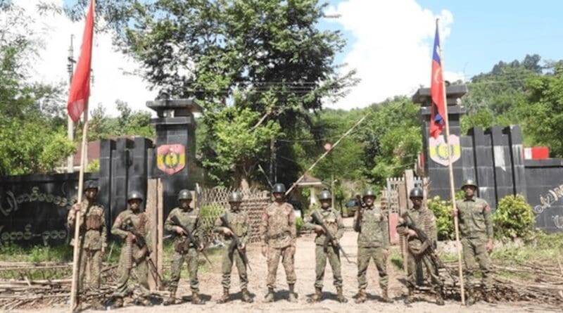 Arakan Army fighters pose outside a military Operational Command Headquarters near Ann town after capturing it. Picture released on Nov. 13, 2024. Photo Credit: AA info desk