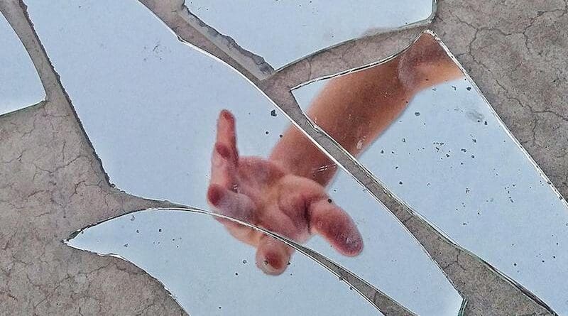 broken mirror hand reflection