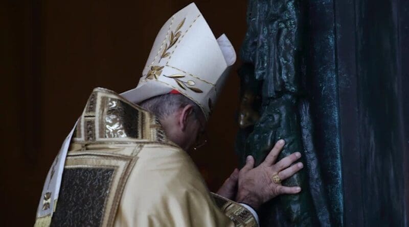 Cardinal Baldassare Reina ceremonially pushes open the Holy Door at St. John Lateran on Dec. 29, 2024. | Credit: Evandro Inetti/EWTN/Vatican Pool