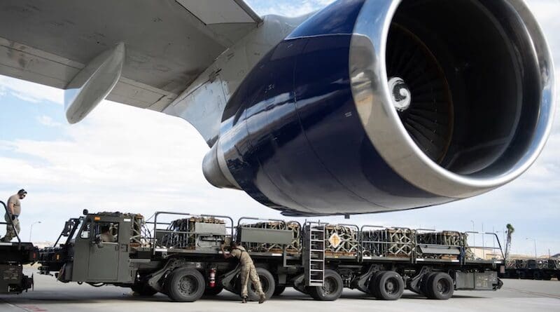 File photo of airmen assigned to the 60th Aerial Port Squadron load pallets of ammunition onto a contracted aircraft bound for Ukraine during a security assistance mission at Travis Air Force Base, Calif. Photo Credit: Air Force Airman 1st Class Robert Nichols
