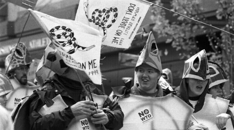 WTO protestors waving the Gadsden Flag in Seattle | Image Credit: Seattle Municipal Archive