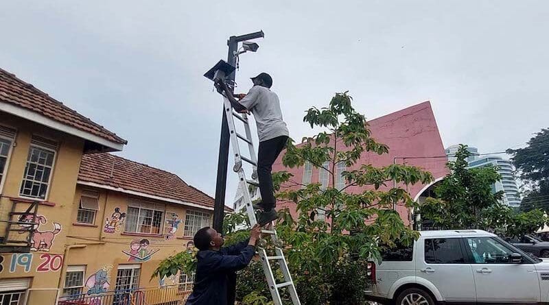 Kampala Capital City Authority staff installing low cost air quality sensors near a school in Kampala city on 16 January. The monitoring system is helping target interventions to reduce emissions. Copyright: Courtesy of Kampala Capital City Authority