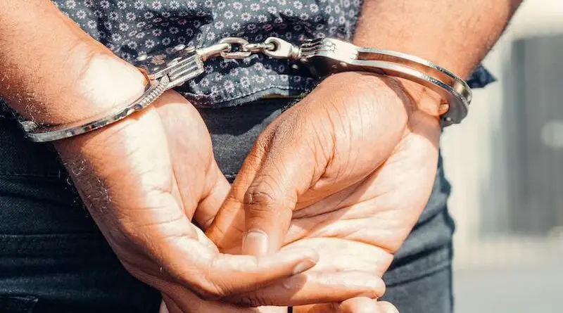handcuffed handcuffs extradition