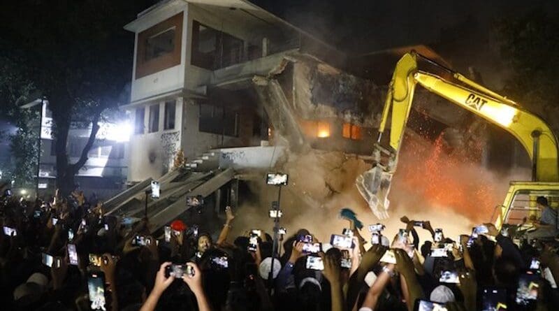 An evacuator is pressed into service to demolish a museum memorial to Sheikh Mujibur Rahman, Bangladesh’s founding president and father of ousted Prime Minister Sheikh Hasina, in Dhaka, Feb. 4, 2025. Photo Credit: Mehedi Rana/BenarNews
