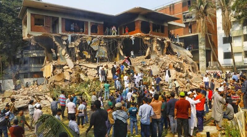 Observers gather to see the ruins of No. 32 Dhanmondi Road, a former memorial museum in Dhaka to Sheikh Mujibur Rahman, father of the ousted Prime Minister Sheikh Hasina, after protesters demolished it, Feb. 6, 2025. Photo Credit: Mehedi Rana/BenarNews
